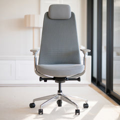 Gray Desky Pinnacle executive office chair with mesh back, soft fabric seat, adjustable headrest, and chrome base.