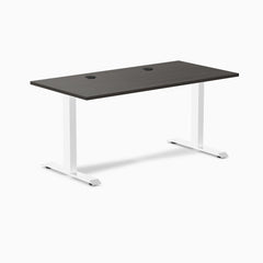 Desky Zero fixed height office desk with burnished wood laminate top, white steel frame, and two grommets.