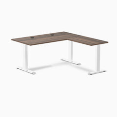 Desky Zero L-shape office desk with Jarrah Legno laminate top, white steel frame, and grommets.