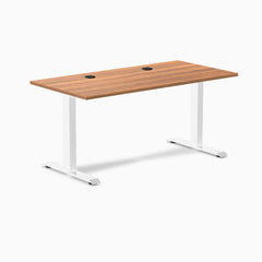 Desky Zero fixed height office desk with Prime Oak laminate top, white steel frame, and two grommets.