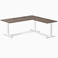Desky Zero L-shape office desk with Jarrah Legno laminate top, white steel frame, and grommets.