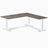 Desky Zero L-shape office desk with Jarrah Legno laminate top, white steel frame, and grommets.