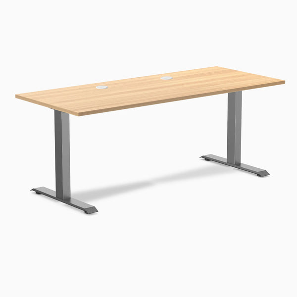 Desky Zero fixed height office desk with a Sublime Teak laminate top, Space Gray steel frame, and grommets.