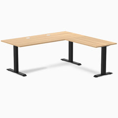 Sublime Teak L-shape office desk with matte black steel frame and grommets.