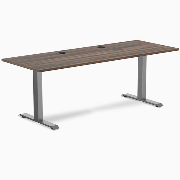 Desky Zero fixed height office desk with Jarrah Legno laminate top, Space Gray steel frame, and grommets.