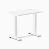 Desky Zero Mini fixed-height desk in white, 32x20 inches, with two grommets for cable management.