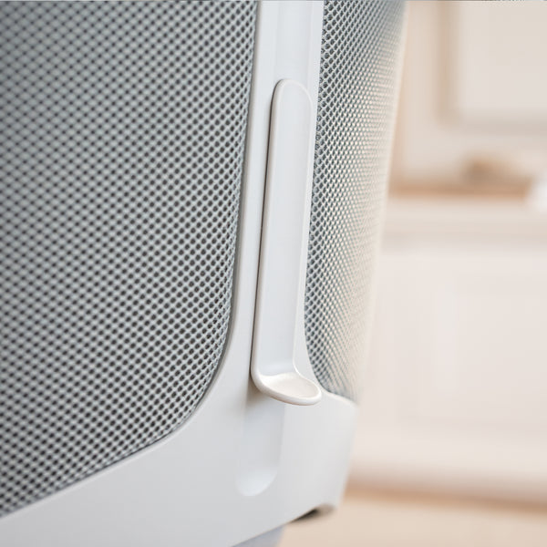 Close-up of the Desky Pinnacle Executive Office Chair's light gray mesh backrest with a white lumbar adjustment lever.