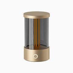 Modern cylindrical lamp with gold finish on a white background