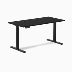 Black Desky Single Sit Stand Desk, 59x29.5 inches, with grommets and height adjustment control.