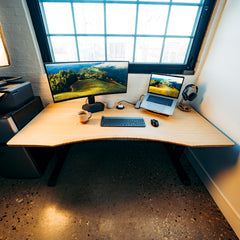Desky Zero Ergo Edge Office Desk with a bamboo top, chamfered edge, and black steel frame.