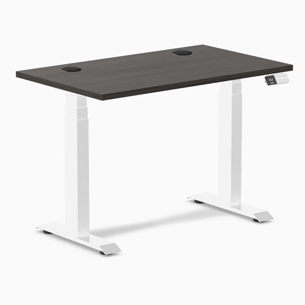 Desky Dual Mini sit-stand desk with burnished wood 40x24 inch top, white frame, and grommets.