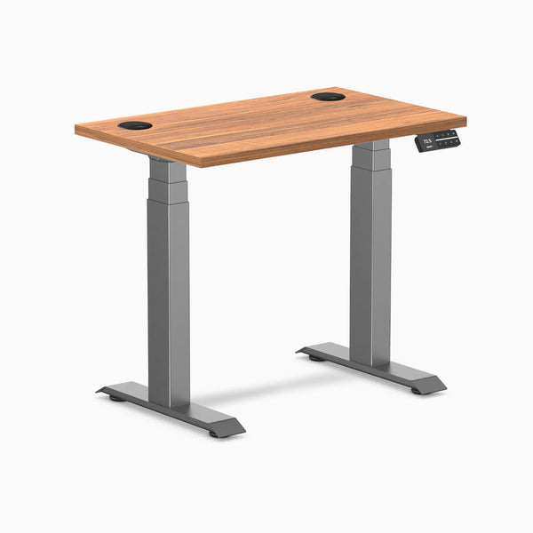 Desky Dual Mini sit-stand desk, Prime Oak 32x20 inch top with grommets, Space Gray frame.