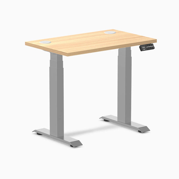 Desky Dual Mini sit-stand desk, Sublime Teak 32x20 inch top with grommets, gray frame.