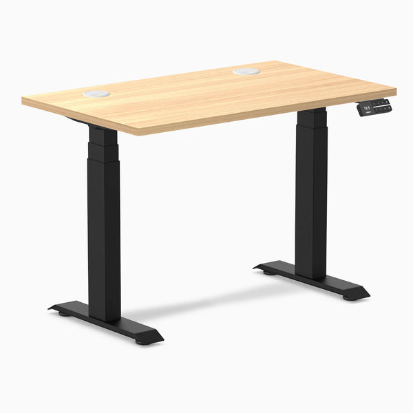 Desky Dual Mini sit-stand desk, 40x24 inch Sublime Teak top with grommets, matte black frame.