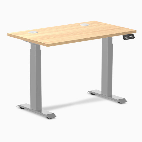 Desky Dual Mini sit-stand desk with a Sublime Teak 40x24 inch top, gray frame, and grommets.