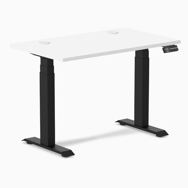 White 40x24 inch Desky Dual Mini sit-stand desk with matte black frame and grommets.