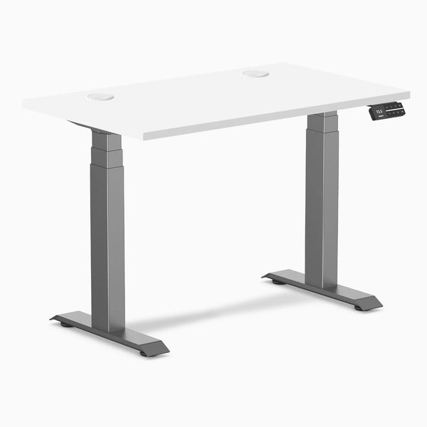 White Desky Dual Mini sit-stand desk, 40x24 inch top with grommets, space gray frame, and digital control panel.