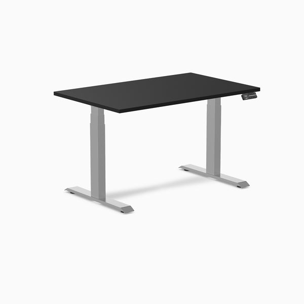 Desky Dual Custom Laminate Sit Stand Desk with black top and silver adjustable legs.