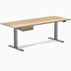 Desky Dual hardwood standing desk, white ash top, space gray legs, and matching under-desk drawer.