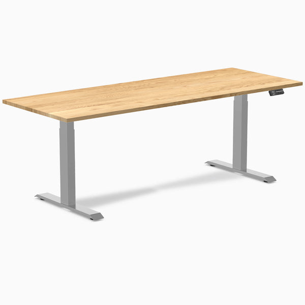Desky Dual 80x30 inch White Oak hardwood sit-stand desk with gray legs and control panel.
