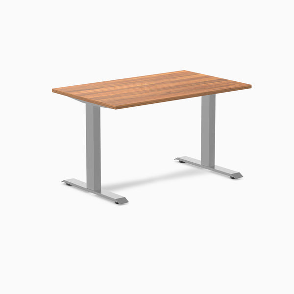 Desky Zero fixed height office desk with a natural wood laminate top and silver steel frame.
