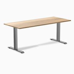 Desky Zero fixed-height office desk with White Ash hardwood top and Space Gray steel frame.