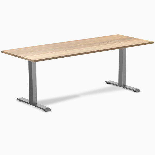 Desky Zero hardwood office desk with a White Ash desktop and Space Gray steel frame.